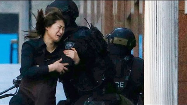 Заложничка от Сидни тази сутрин избяга от похитителят си: ВИДЕО Women hostages flee Sydney siege café