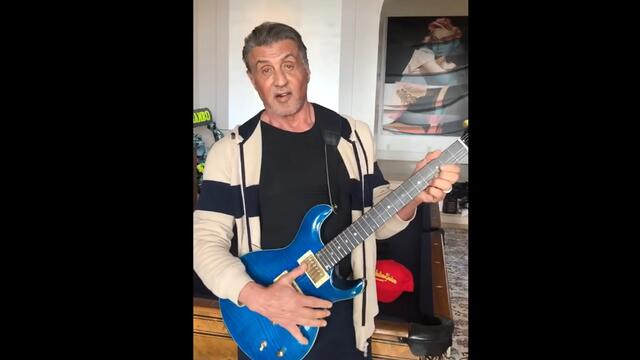 SYLVESTER STALLONE loving his brother's FRANK STALLONE TIGER electric guitar.