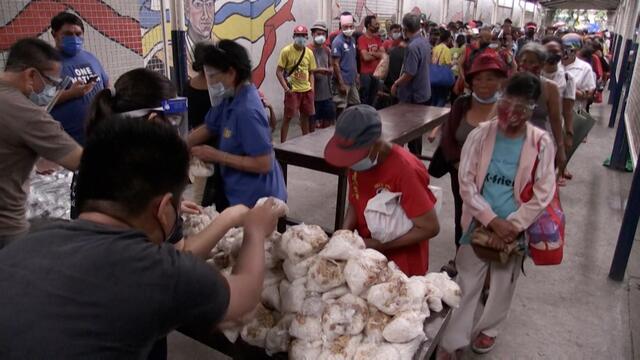 Long queues for free meals as millions in the Philippines go hungry amid coronavirus pandemic