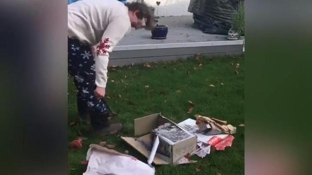 Guy Struggles to Unwrap His Christmas Gift Covered in Concrete