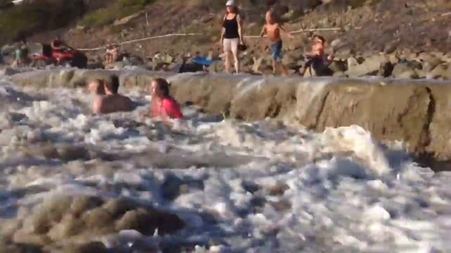 Family Gets Smashed by Huge Wave While Sitting at Beach