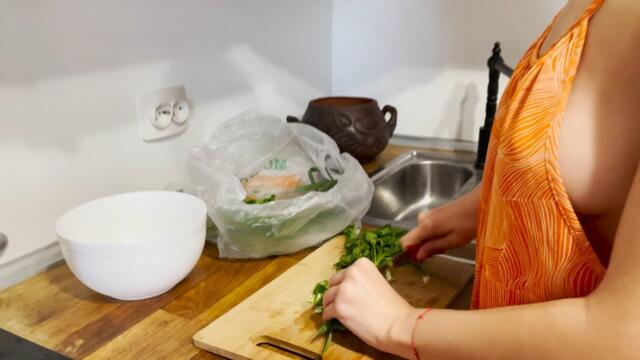 Lera is cooking breakfast and does housework
