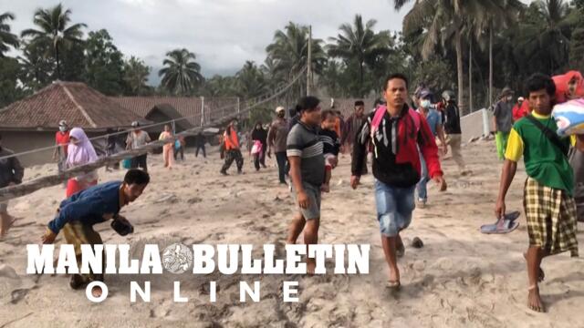 Residents in shadow of Indonesia volcano flee in panic