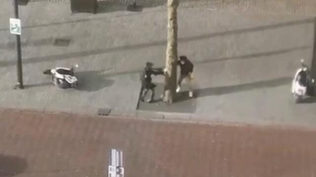 People Trying to Hold On Against Force of Wind During Storm Eunice