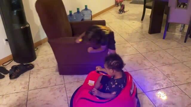 Toddlers Spin Around On Sofa And Toy Car