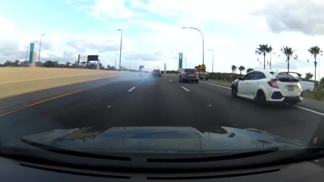 Over Speeding Sports Car Spins on Highway and Crashes in Sidewall