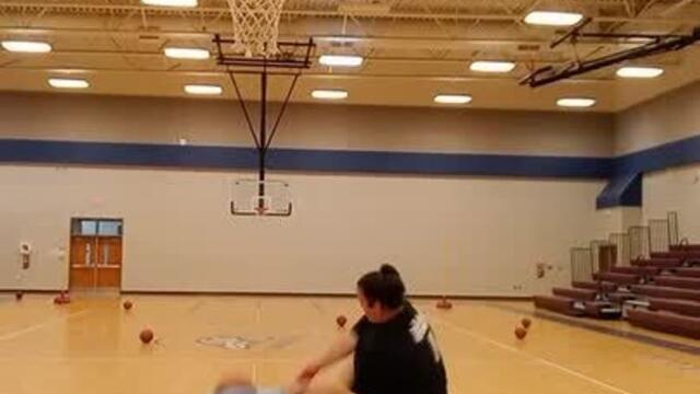 Woman Does Basketball Trickshot