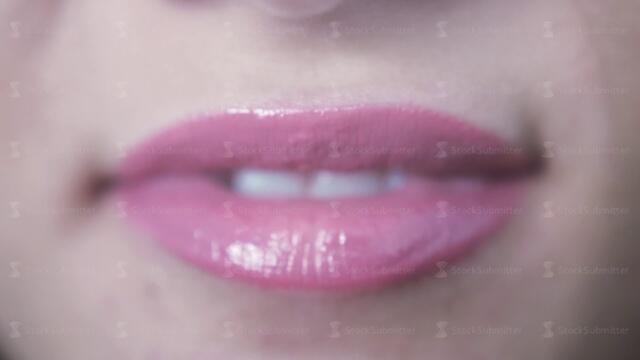 Close up of beautiful smiling sensual pink lips of young girl with open mouth and teeth. 3840x2160