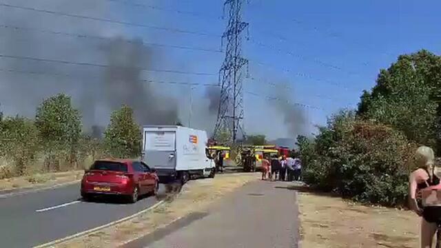 Grass fire breaks out at housing development
