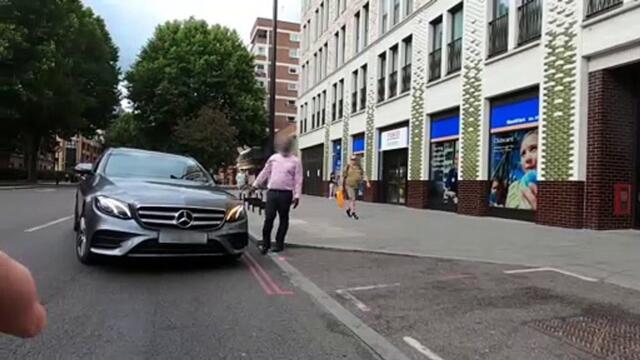 Foul-mouthed cyclist rages at driver after colliding in central London when vehicle suddenly pulls in
