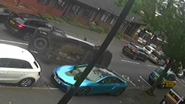 Moment Range Rover flips and crashes into Audi and BMW