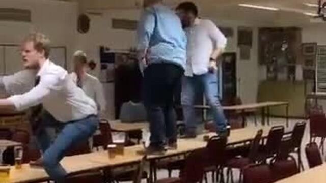 Drunk Guy Falls While Getting Down From Table