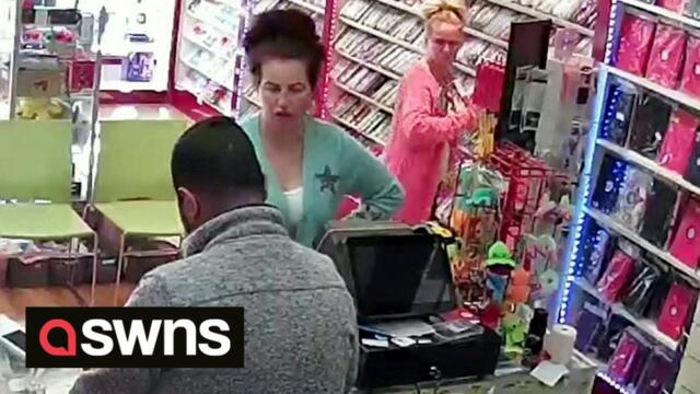 Bizarre moment female thief distracts shopkeeper by dancing while pal stuffs goods down her top