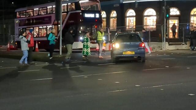 Campaigners form human chain to block vehicles flouting rules at Edinburgh junction