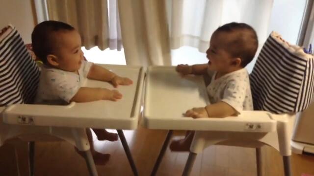 Twin Babies Play Together and Laugh at Each Other