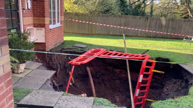 Dad tells how he cheated death by "three seconds" after a 70ft sinkhole appeared in front of his home