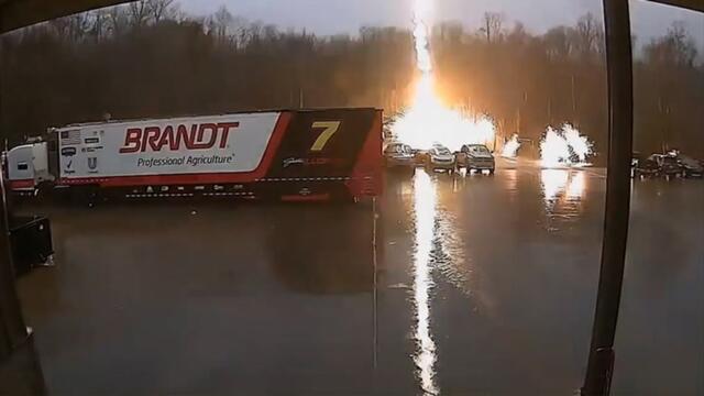 Crazy moment lightning bolt strikes parked truck, sending sparks flying across car park