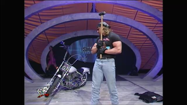 Triple H destroys the Undertaker's motorcycle