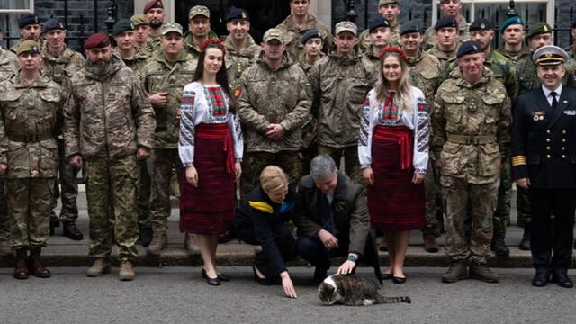 Ukrainian ambassador plays with Larry the cat outside 10 Downing Street