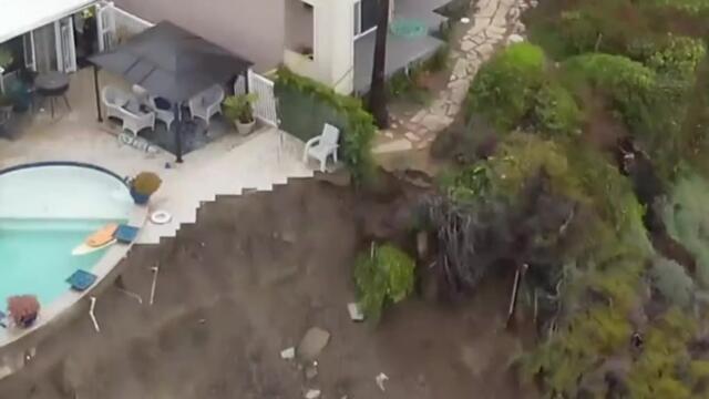 Swimming pool hangs over edge of crumbling cliff after landslide in California