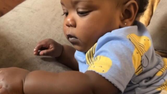 Adorable baby girl takes matters into her own hands after dad takes a break from patting her
