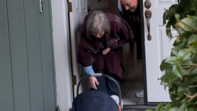 Surprising grandparents with their grandbaby on the front doorstep