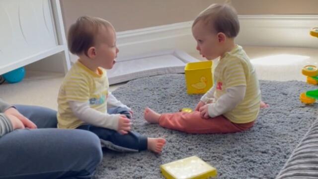 Twin toddler playfully slaps his identical brother, Hilarious Reaction