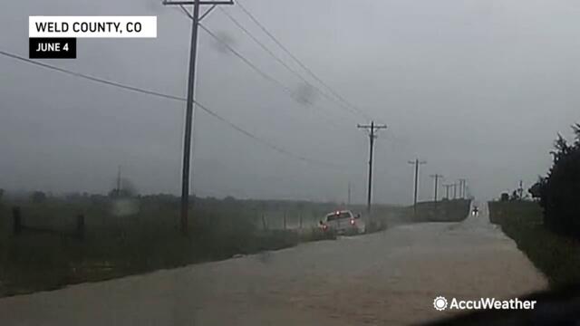 Truck hydroplanes off flooded road