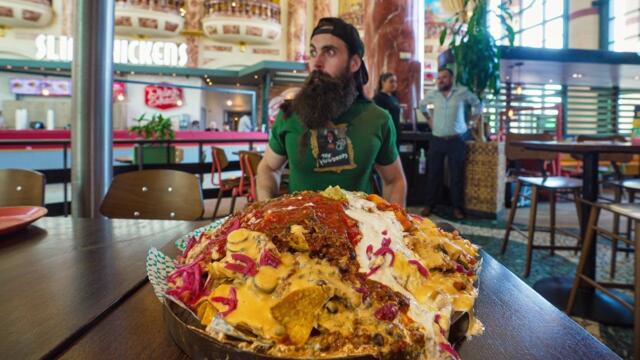 ATTEMPTING AN UNEXPECTEDLY SPICY NACHO MOUNTAIN CHALLENGE | BeardMeatsFood
