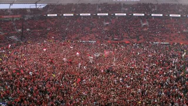 The moment Bayer Leverkusen fans stormed the pitch after winning their first ever Bundesliga
