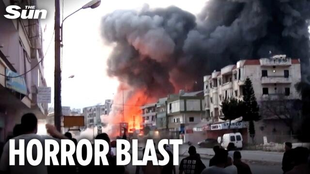 Building EXPLODES metres from crowd in Israeli strike on Lebanon