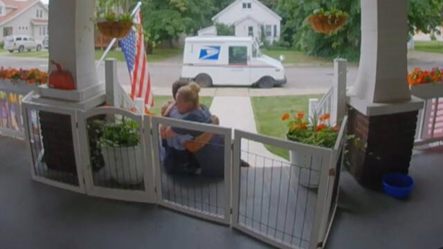 Woman and Mailman Share Special Moment After Important Delivery