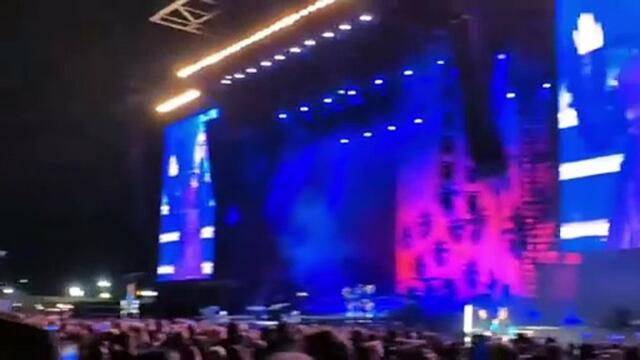 Perrie performs with Robbie Williams at Come Together Festival