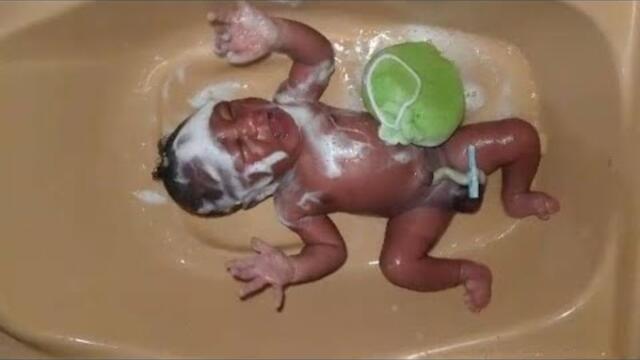 Bathing a newborn.