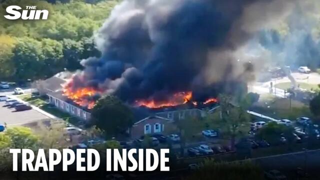 One dead and ‘hundreds trapped’ after suspect opens fire in Michigan church and building set ablaze