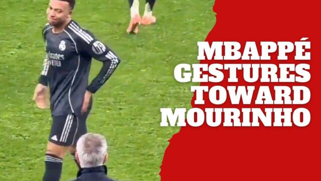 Kylian Mbappé makes gestures while looking at José Mourinho after scoring against his Benfica side