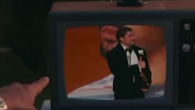 Bad Bunny hands his Grammy to a kid during the halftime show.