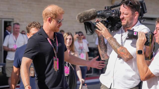 ‘Like he’s Mickey Mouse’: Prince Harry takes pictures with ‘paying customers’