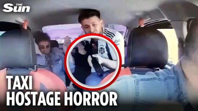 Terrifying moment shotgun-wielding passenger takes taxi driver hostage
