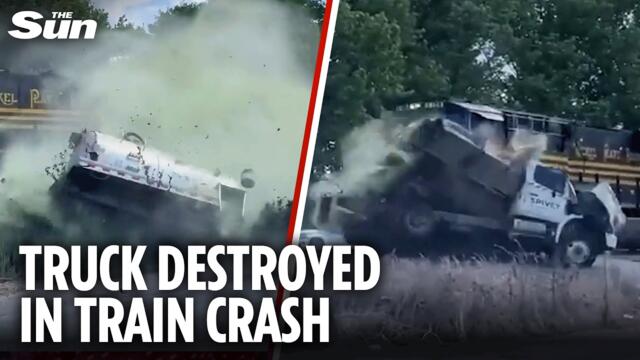 Shocking moment train smashes into septic tank truck sending gallons of waste flying through air