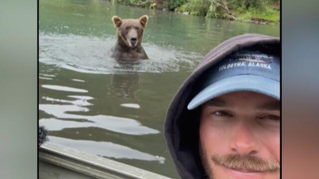 Fishing Guide Takes Calm Selfie With Grizzly Bear Right Behind Him
