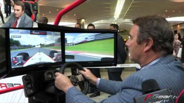 Nigel Mansell playing F1 racing video game